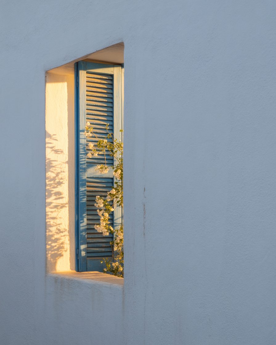 Shuttered Greek balcony at golden hour overlooking Rafina, East Attica — Estia editorial